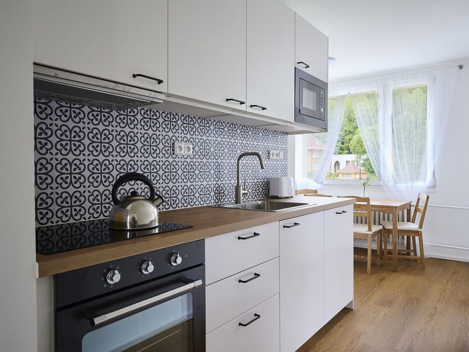Kitchen, Countertop, Kitchen Appliance, Flooring, Interior Design, Major Appliance, Cabinetry, Sink, Plumbing Fixture, Floor