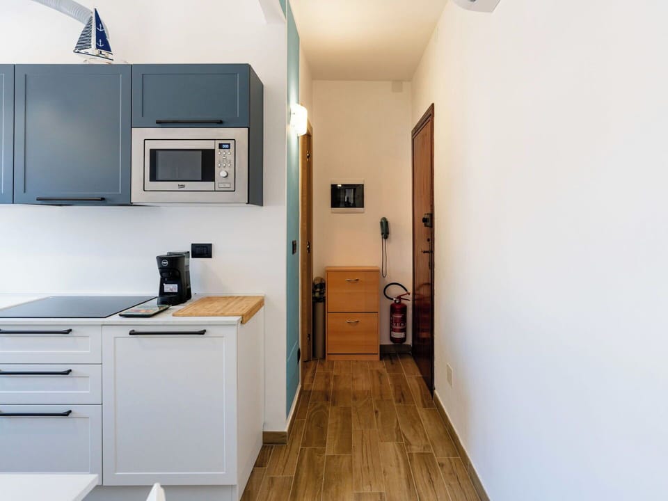 Furniture, Interior Design, Cabinetry, Kitchen, Countertop, Major Appliance, Wood, Flooring, Kitchen Appliance, Floor