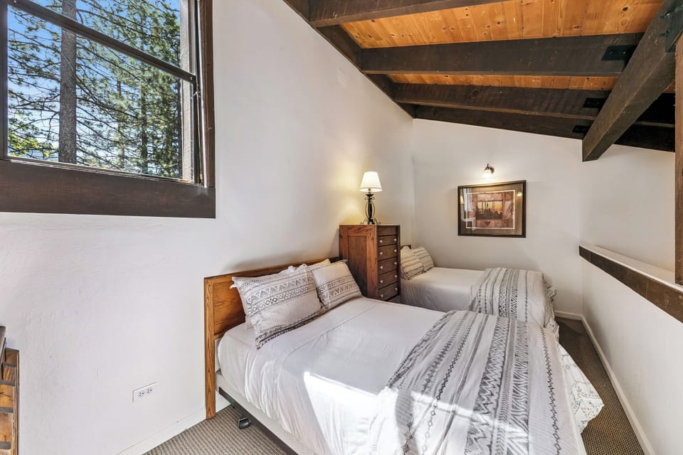 Lofted sleeping area with two double beds