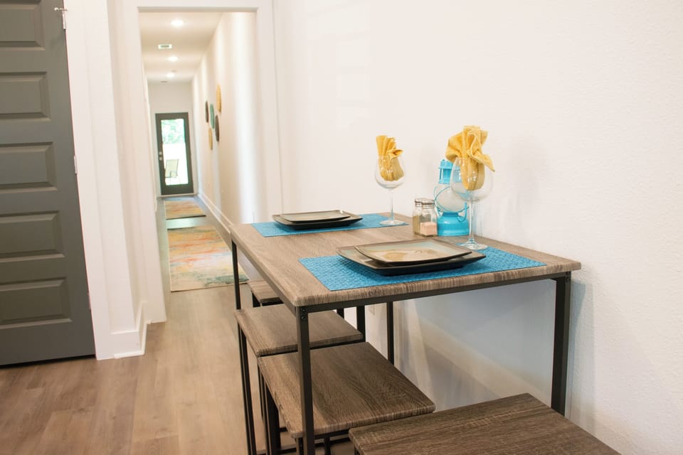 Enjoy a casual meal at the stylish bistro table, ideal for intimate dining or a quick bite.