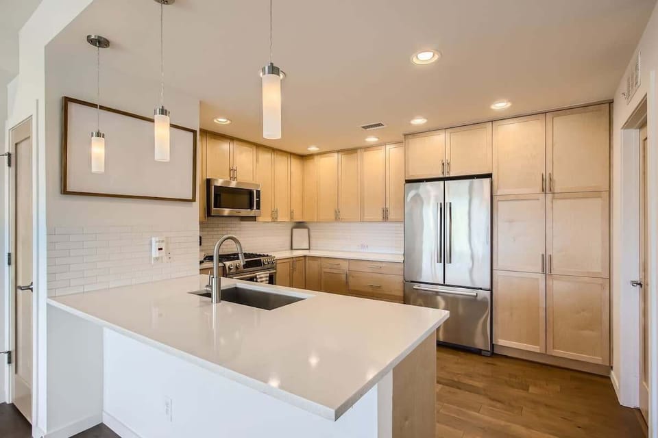 Fully equipped modern kitchen with sleek appliances and everything you need for cooking and dining.