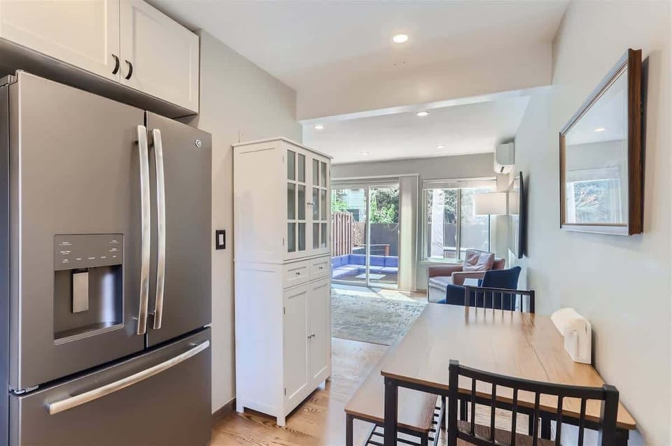 Compact kitchen with a cozy seating area, perfect for casual meals or morning coffee.