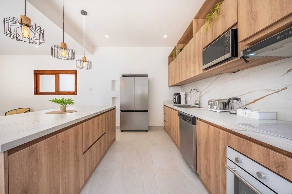 Bright kitchen flooded with natural light and elegant finishes.