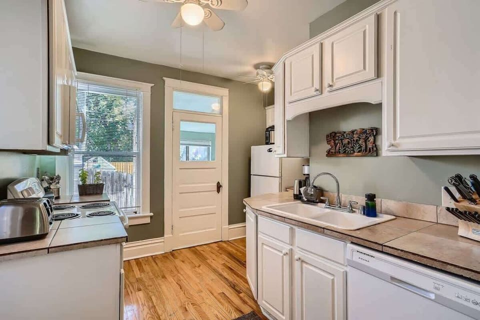 Functional Kitchen that Opens Directly to the Back Space , Perfect for Enjoying Fresh Air.