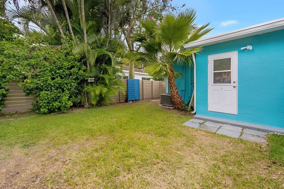 Well-kept backyard area with greenery and a utility shed.