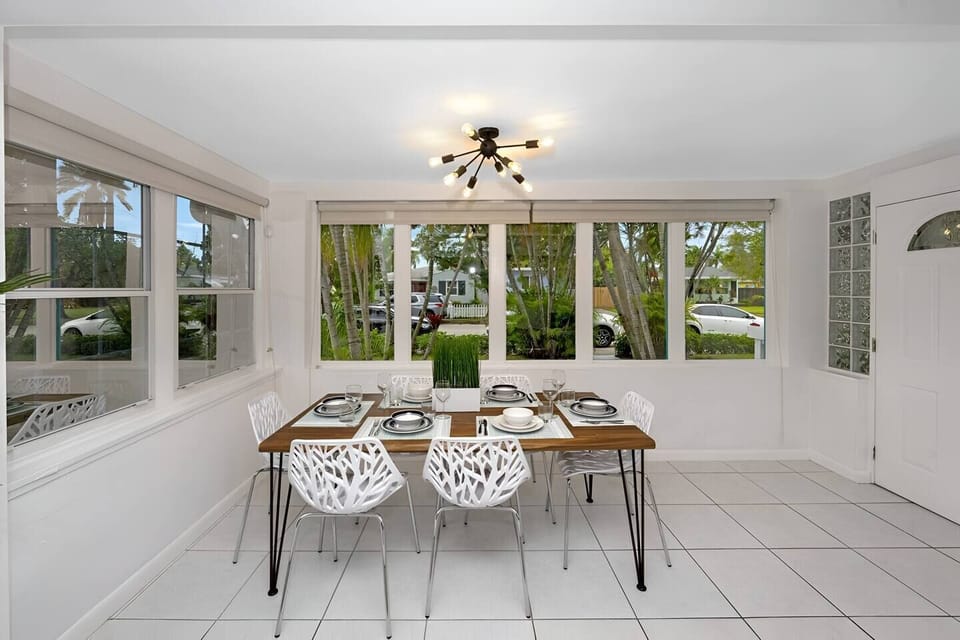Neat kitchen and dining area with ample sunlight.
