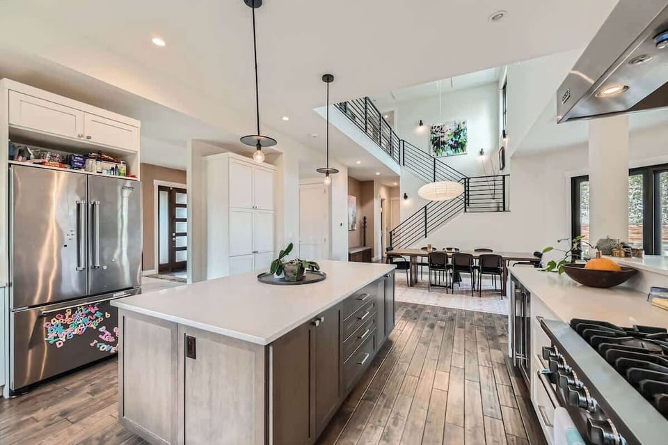 Cook, dine, and gather in style with this open-concept kitchen and dining space.