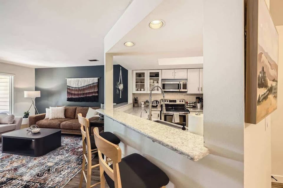 Two bar stools facing the kitchen 