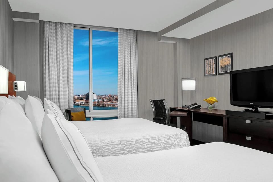 Wake up to sunshine and skyline views from bed.