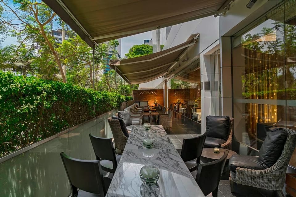 Unwind outdoors beneath shaded canopies with leafy, private vibes.