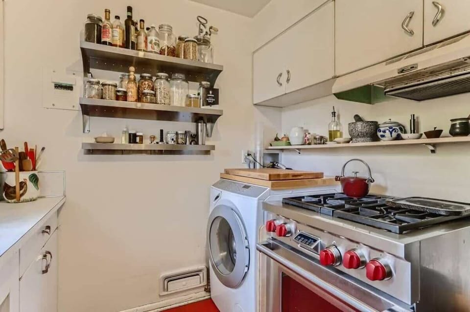 Washer/dryer combo located in the kitchen 