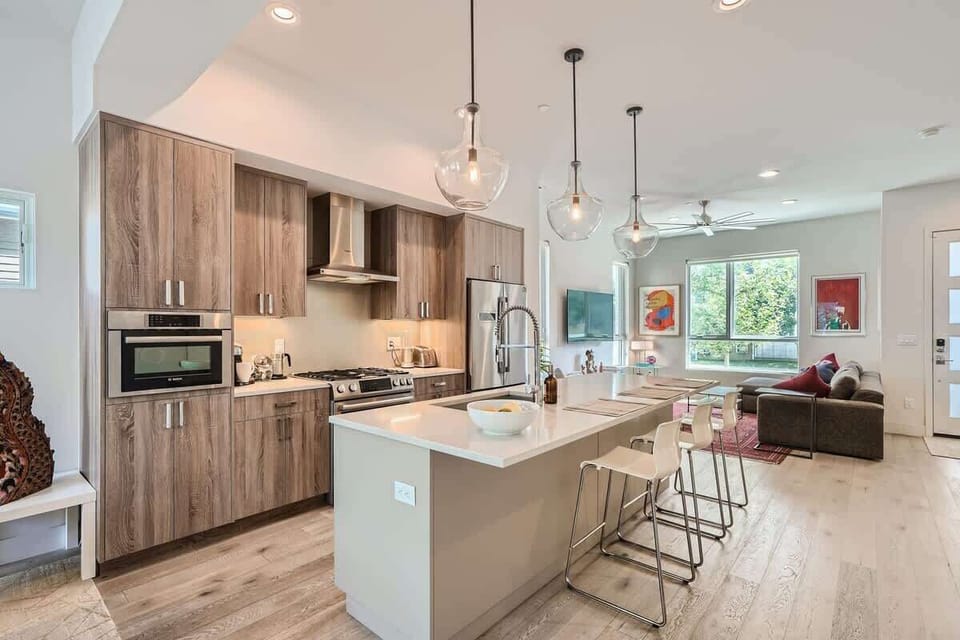 A modern kitchen fully stocked with cookware, utensils, and appliances, ready for preparing meals with ease.