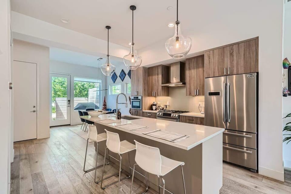 Kitchen with bar seating for three convenient for fast meals or homework