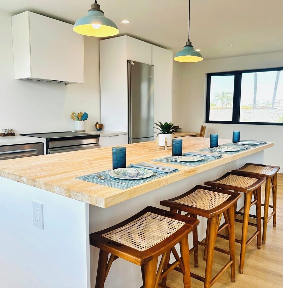 Galley kitchen, island and dedicated work space.