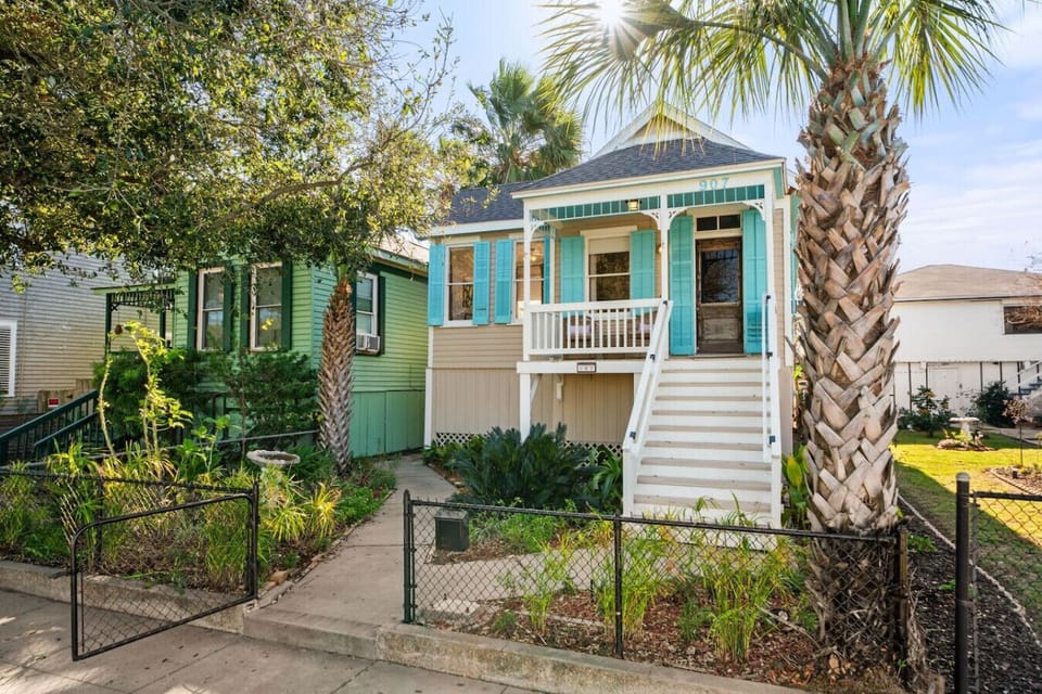Classic Galveston charm with palm-lined curb appeal.