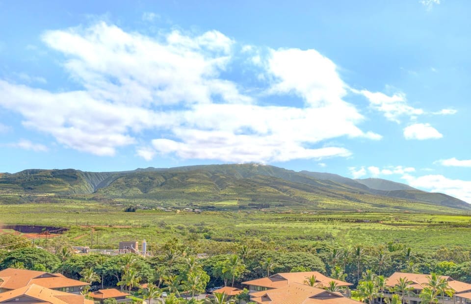 Lush green valleys, sun-kissed rooftops, majestic mountains meet sky. HKK-820