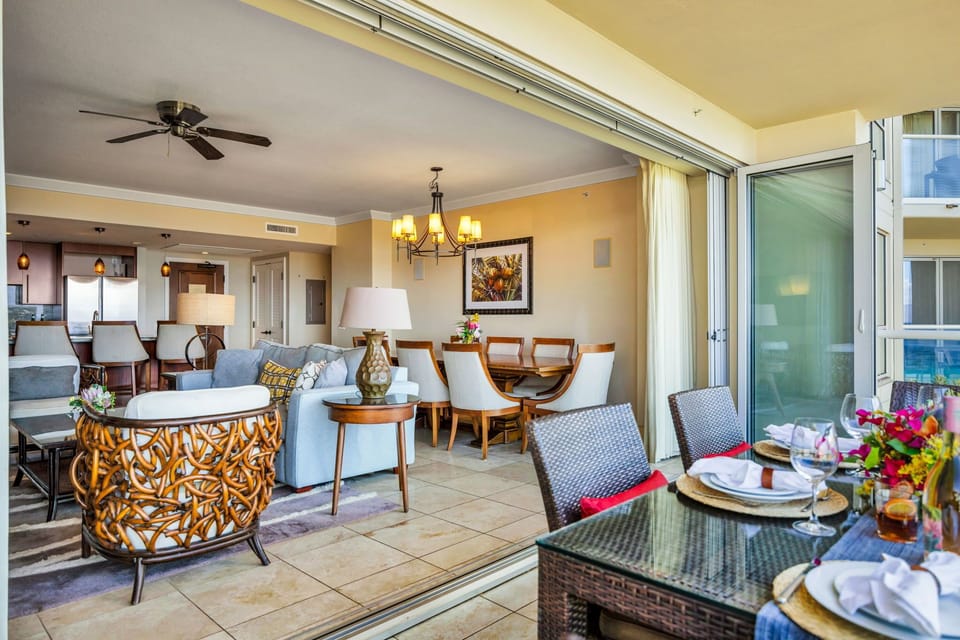 Indoor-outdoor flow from living to lanai with ocean and pool views just beyond. HKK-825