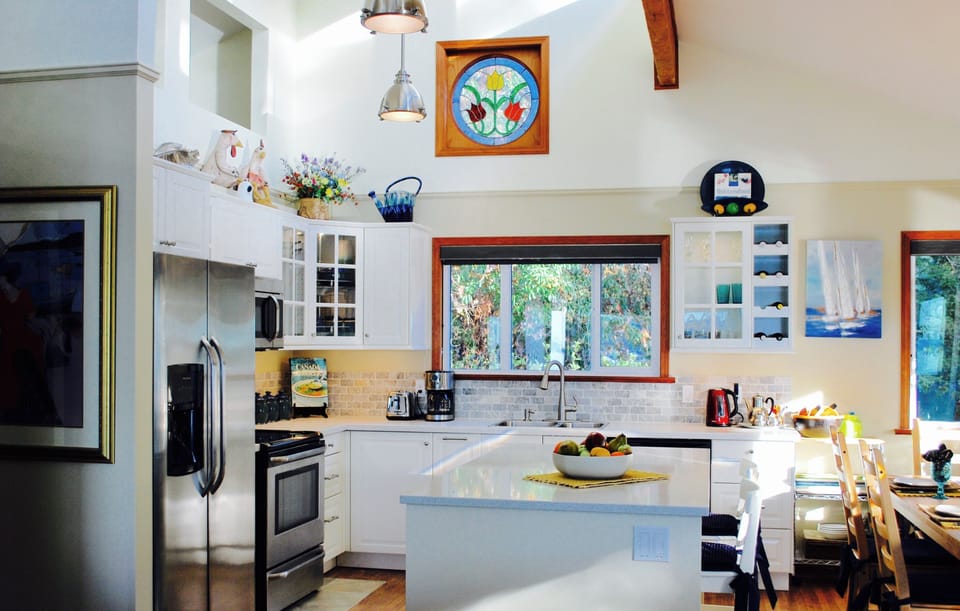 This open concept entertainment kitchen features stainless steel appliances