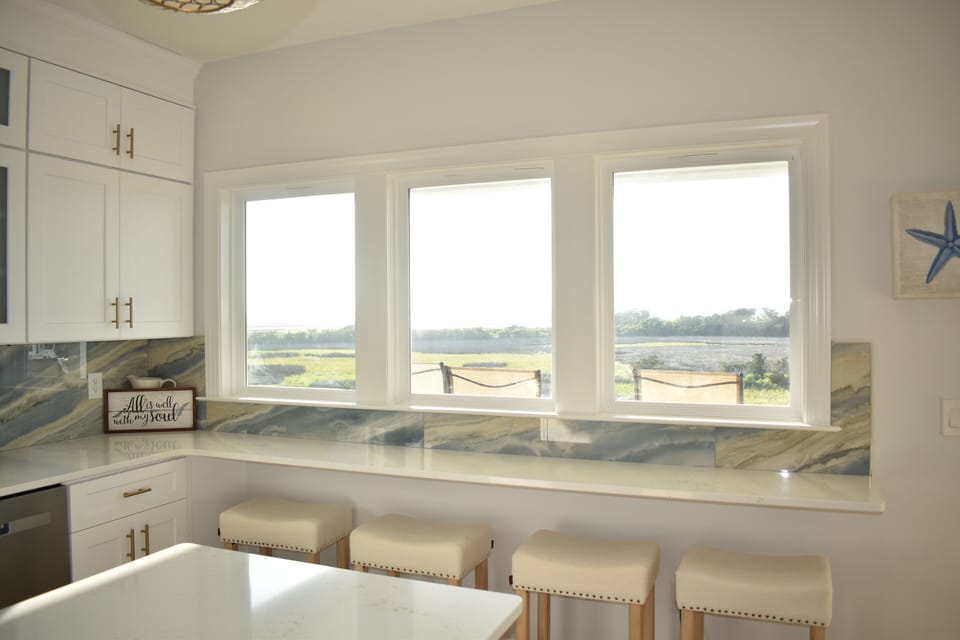 Bar seating overlooks the sound -- enjoy a peaceful coastal backdrop while dining or sipping drinks.