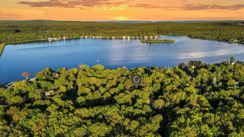 Nestled in nature’s embrace and just minutes from the sparkling waters, this home is your perfect mix of mountain tranquility and lakeside fun. Adventure and relaxation? Yes, please!

