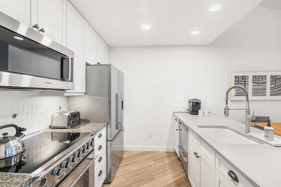 This bright and modern kitchen has everything you need to prepare full meals or light snacks on your vacation