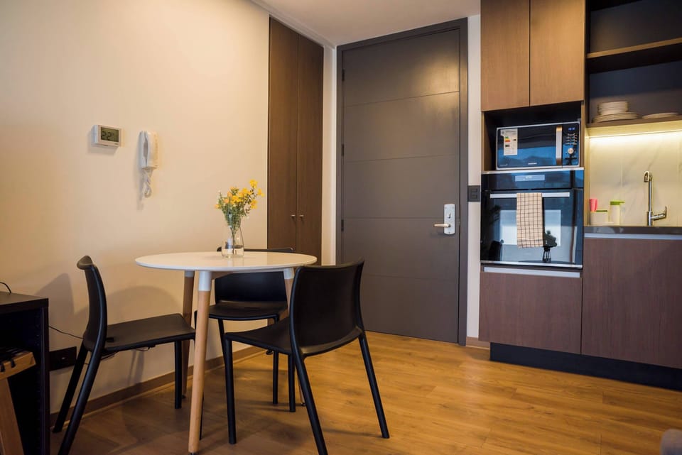 Cozy kitchen nook with modern appliances, perfect for intimate meals and relaxation.