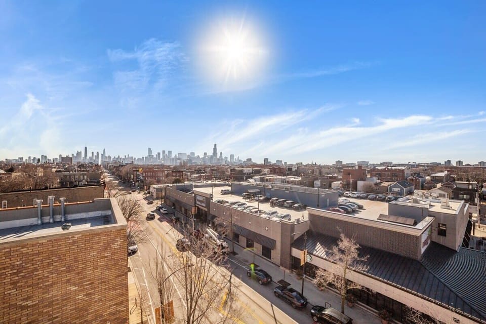 Wide rooftop deck offering open-sky hangout vibes