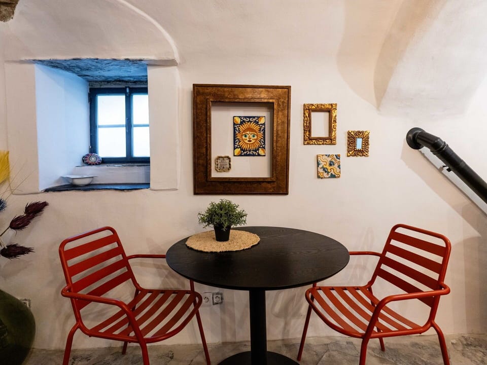 Furniture, Wall, Interior Design, Flooring, Chair, Floor, Table, Orange, Room, Ceiling