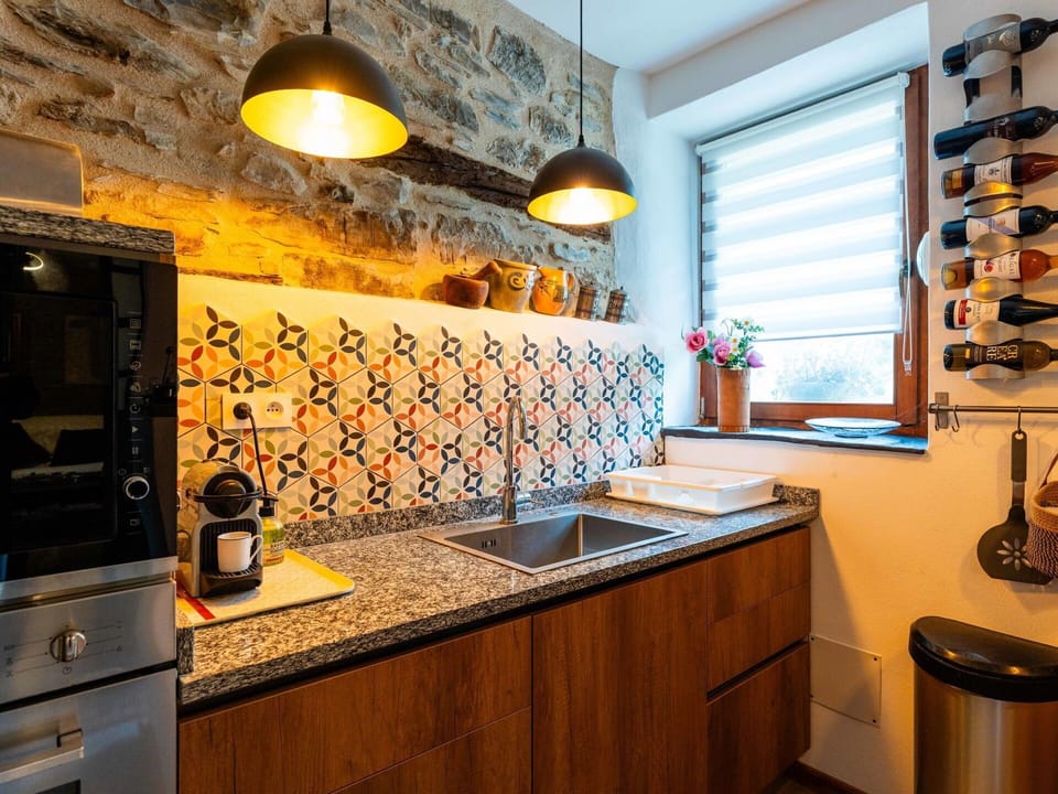 Kitchen, Countertop, Interior Design, Kitchen Appliance, Yellow, Flooring, Lighting, Major Appliance, Cabinetry, Room