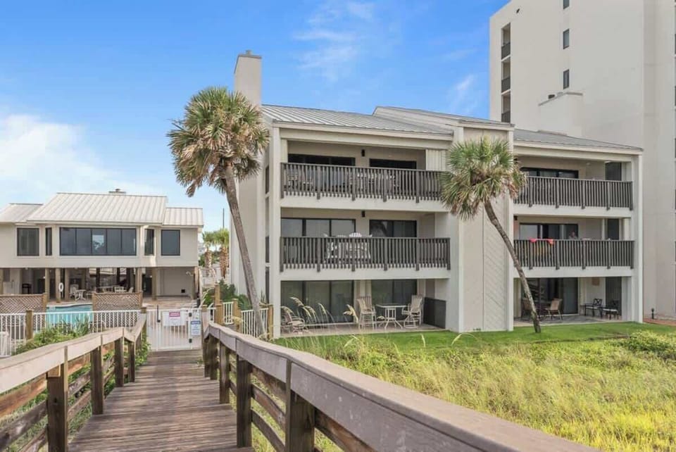 Exterior View of the condo on the right and Clubhouse #1 on the left.