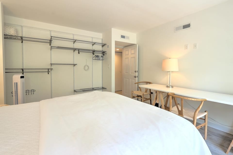 Bedroom 2 with queen bed and balcony 