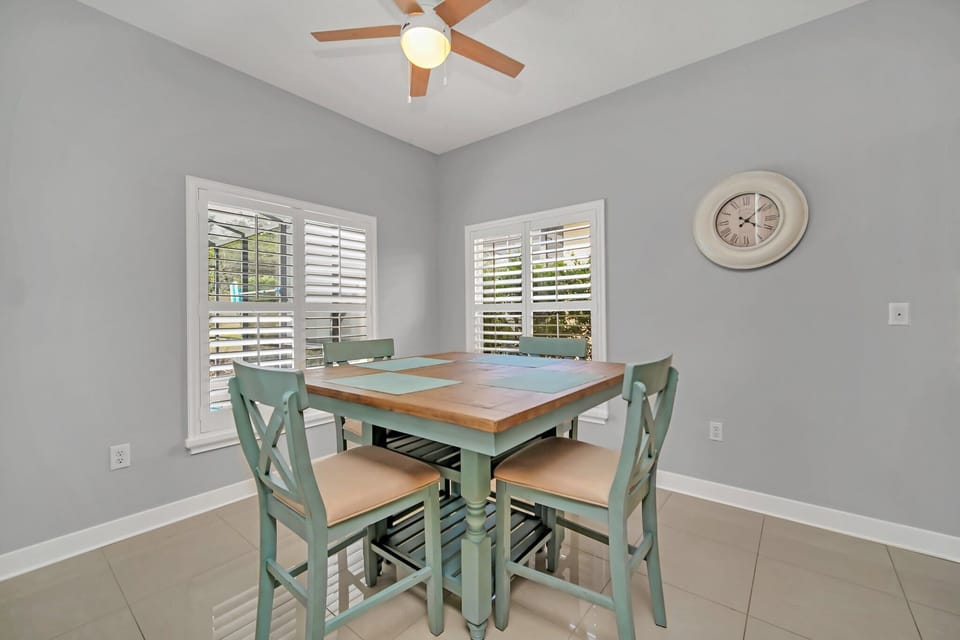 Bright Dining Space with Stylish Green Accent Chairs