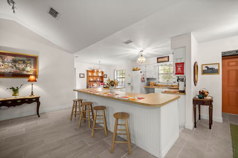 Spacious kitchen counter area with room to cook and gather.