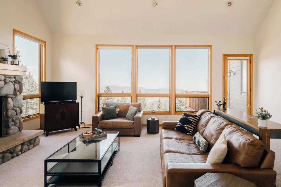 Main level living room with comfy couches and a grand view