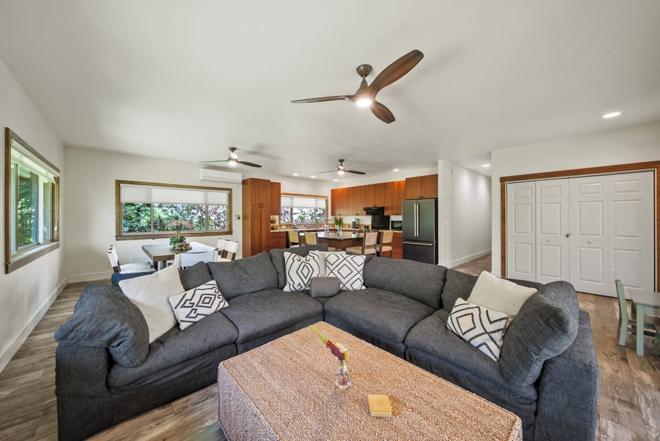 Spacious open-concept living room with sectional seating—perfect for unwinding after a North Shore day.