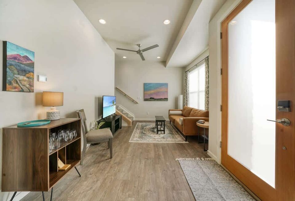 Inviting living room with smart TV leading to upstairs bedrooms