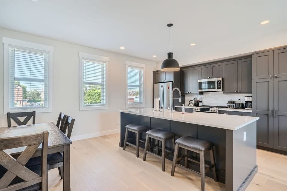 Modern kitchen flowing naturally into the dining space