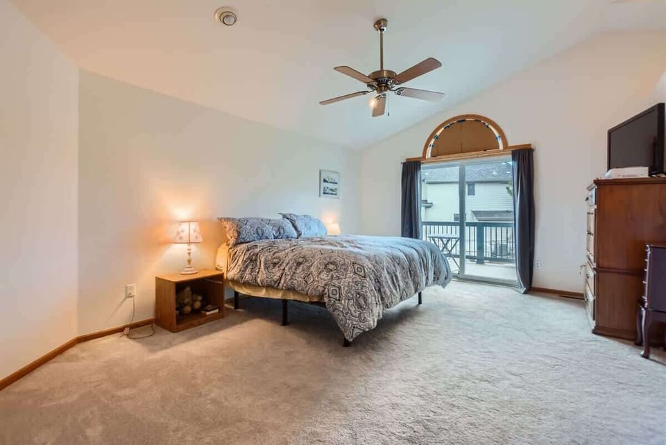 Comfortable Primary Bedroom with Cozy Bedding Featuring a King Sized Bed 