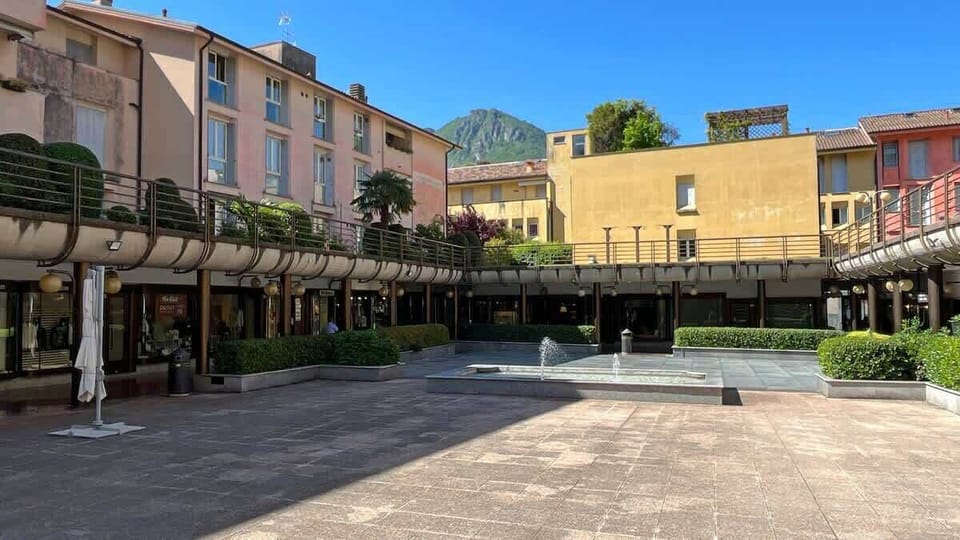 very gracious square surrounded by shops in the town center