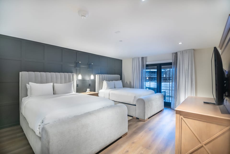 Recharge after adventures in a softly lit, serene bedroom.