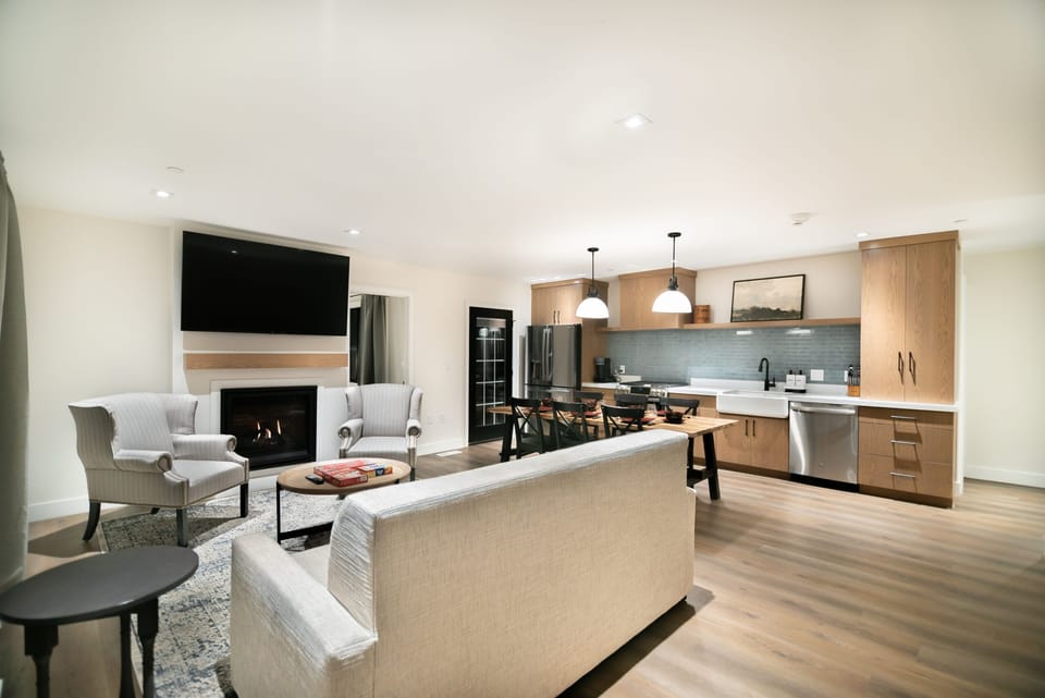 Gather by the fireplace, then flow into the open kitchen.