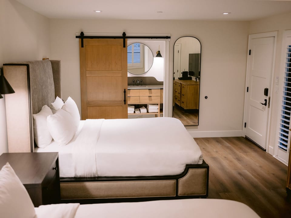 Settle into a stylish king retreat with warm, modern touches.