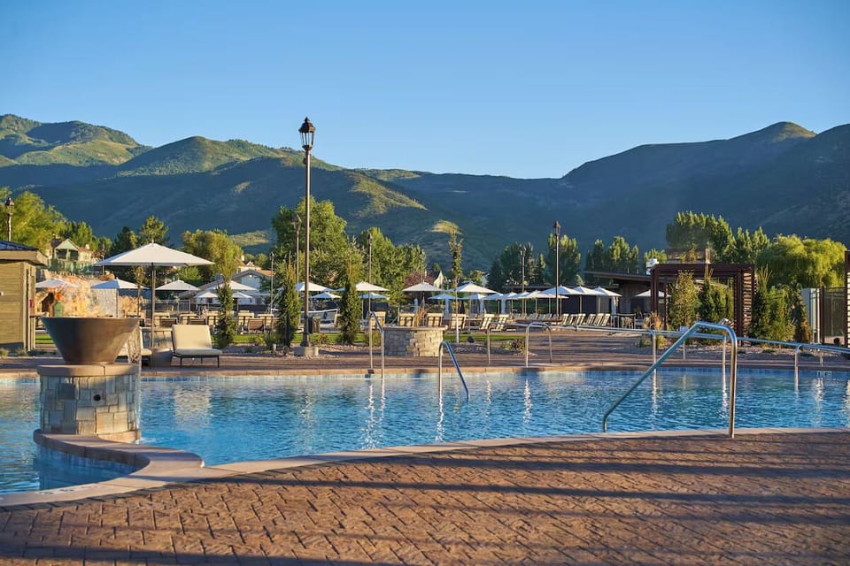 Dive into mountain-view serenity in the sparkling resort pool