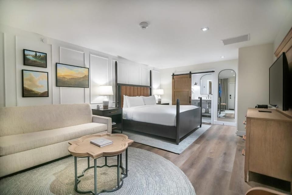 Stretch out in a spacious suite with sofa and calming décor.