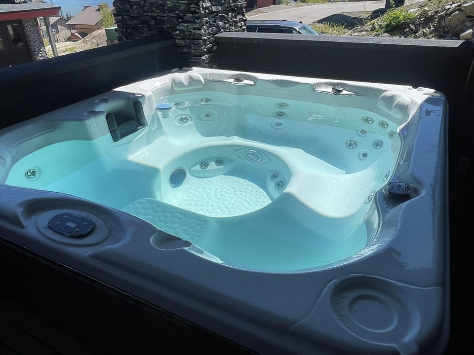 The hot tub is on the balcony off of the Grand Master.  Its BIG