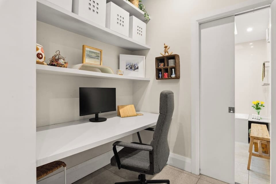Stay productive at the dedicated desk space tucked quietly away, ideal for remote work with reliable Wi-Fi throughout the home.