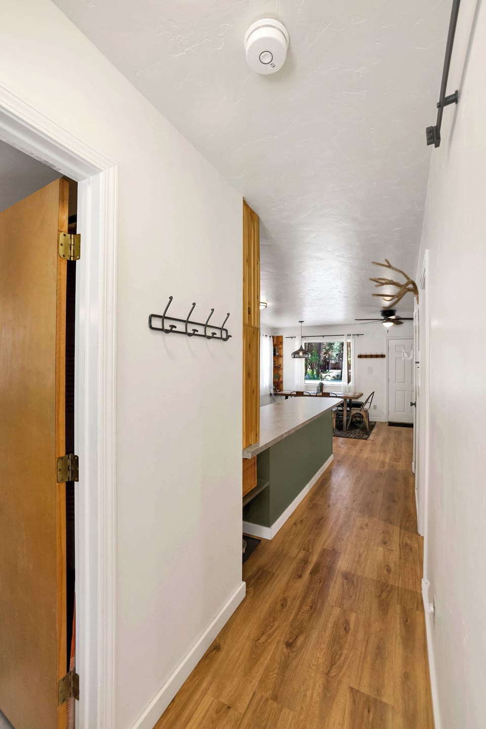 Welcoming hallway with handy hooks—perfect for coats, hats, and gear!