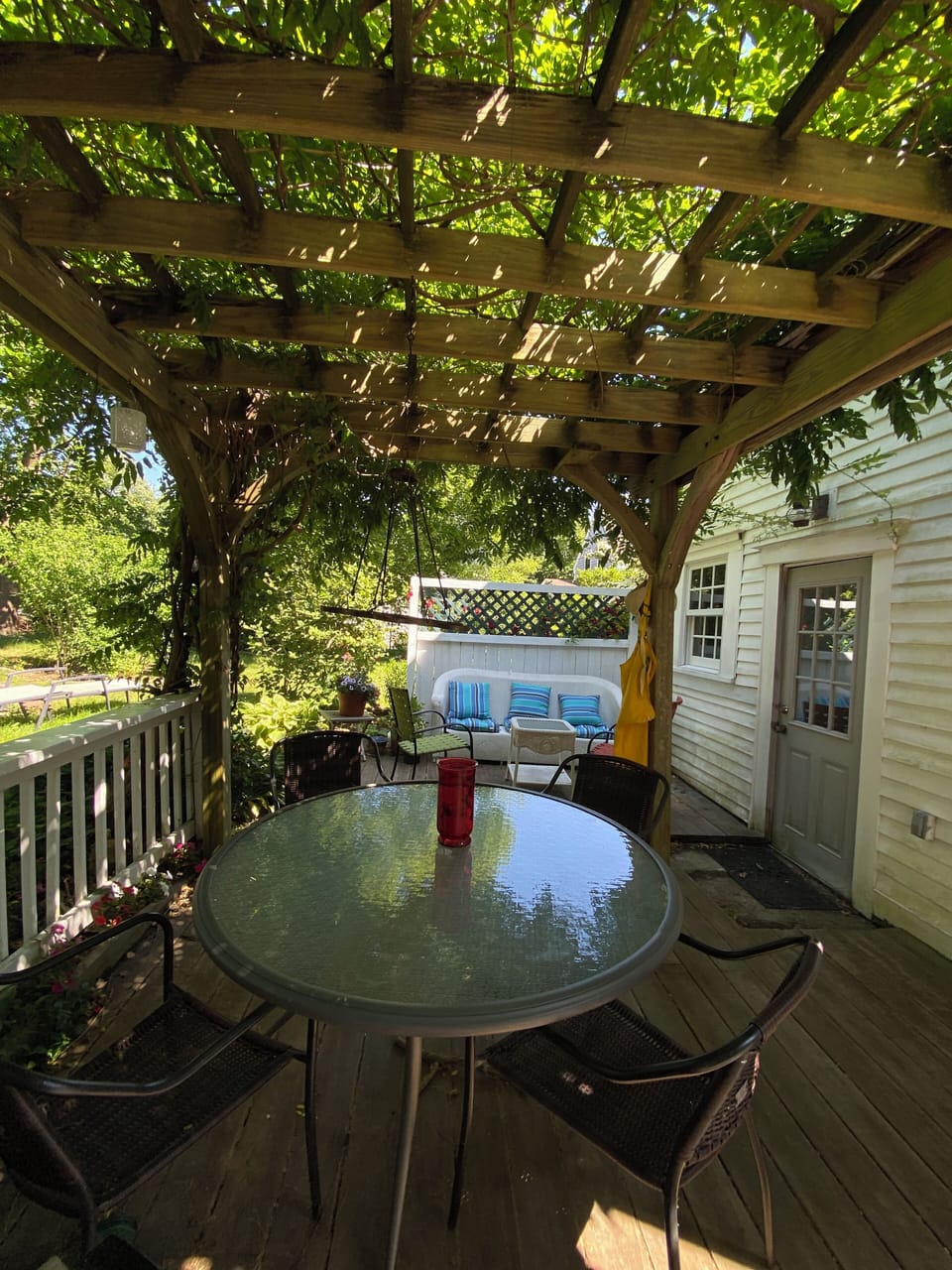 Enjoy your morning coffee or afternoon wine on our wisteria shaded pergola 