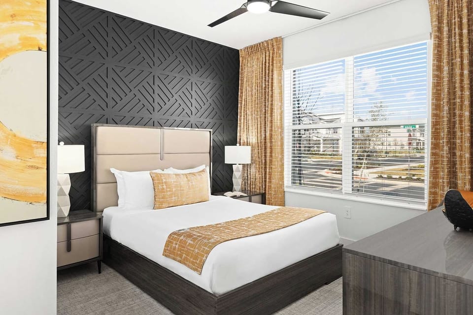 Drift off beneath bold textures in a sunlit, cozy bedroom.