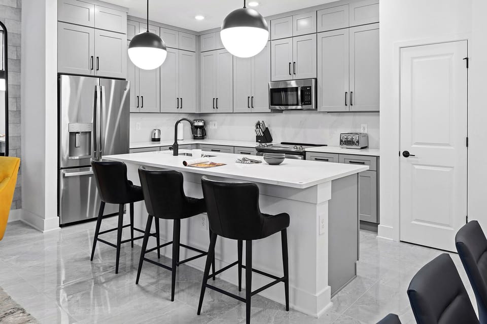 Host memorable dinners around the stylish table under soft lighting.